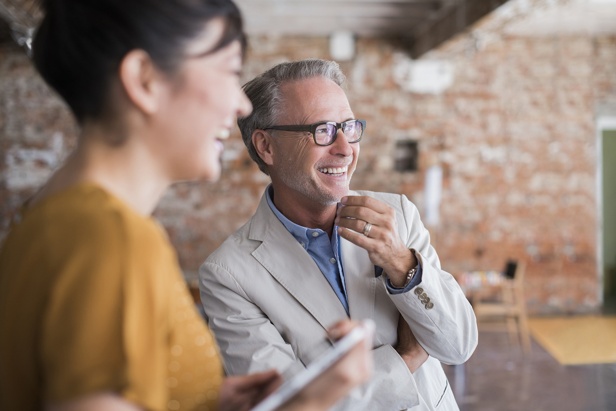 Smiling business people looking away in office